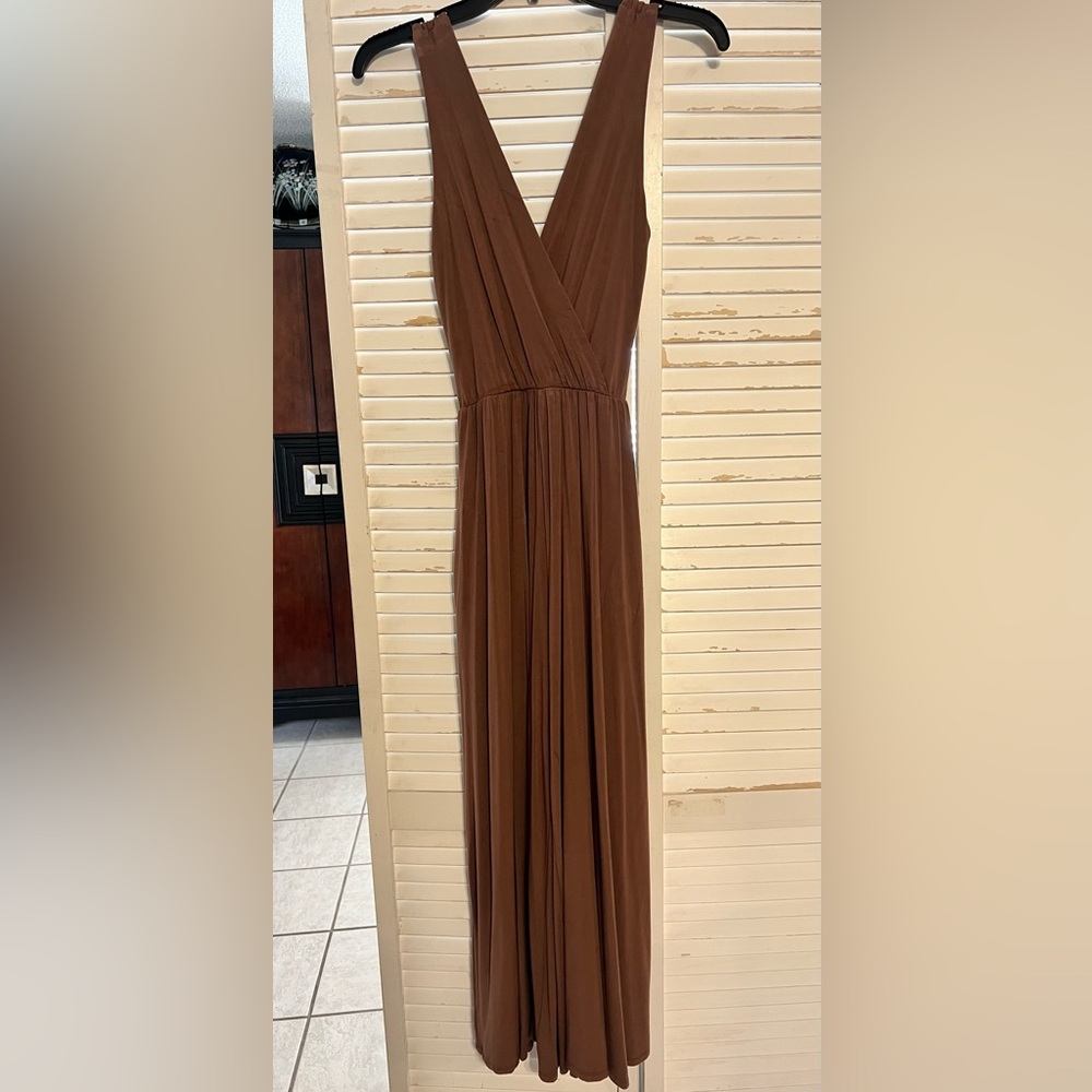 Elegant Brown Sleeveless jumpsuit with hidden side pockets. Elastic waist